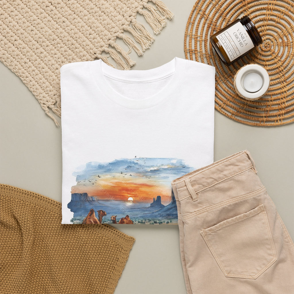 Watercolor desert t-shirt with camels walking toward a setting sun and sandstone buttes