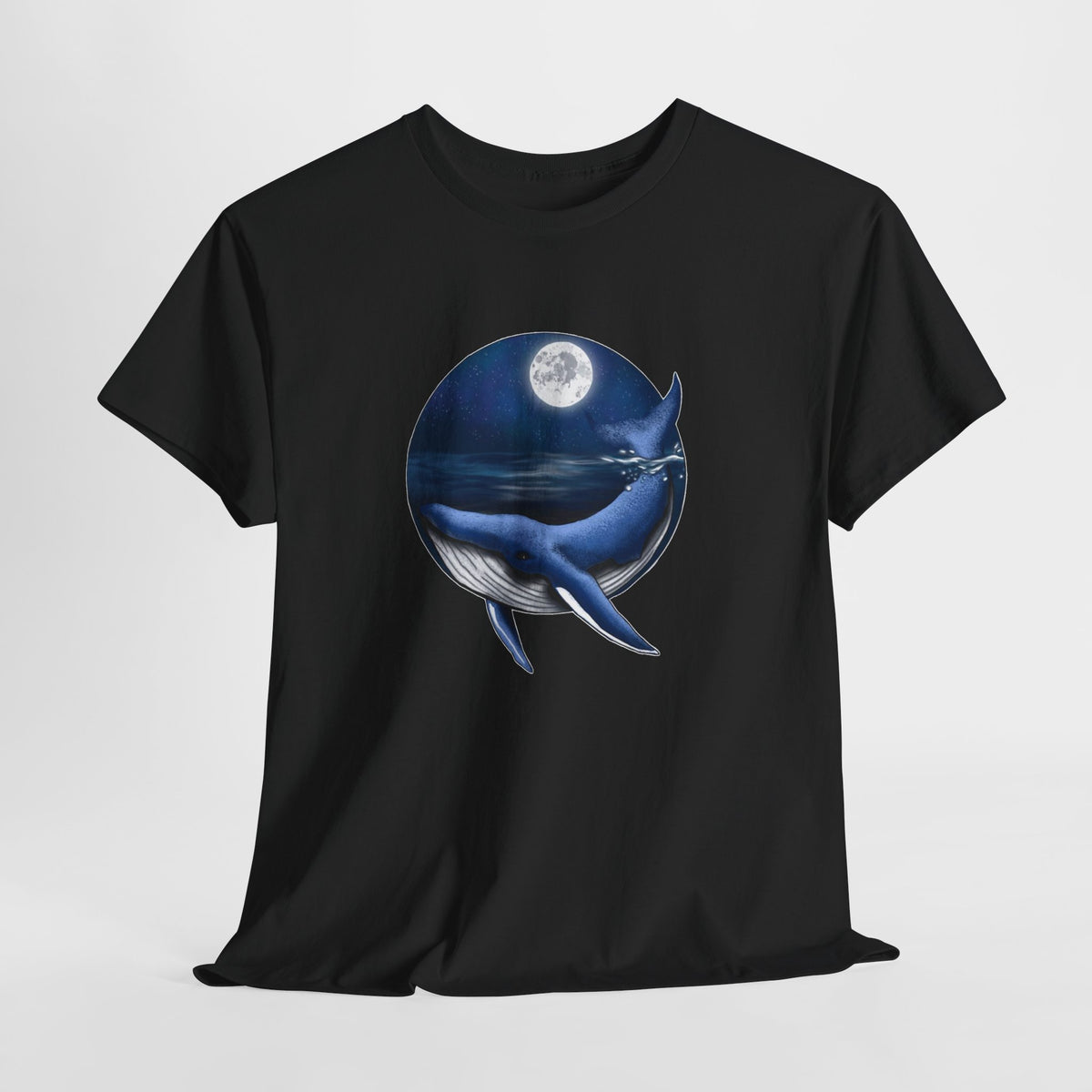 Whale t-shirt with a whale swimming under a full moon in a blue circle