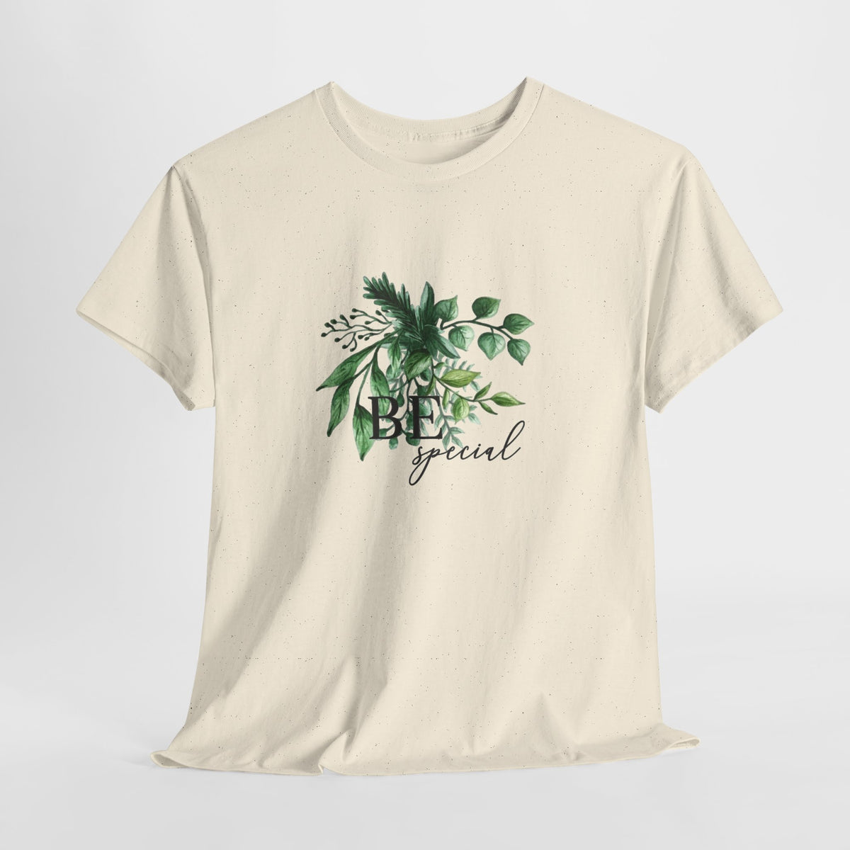 Botanical t-shirt with a short uplifting message among watercolor green leaves