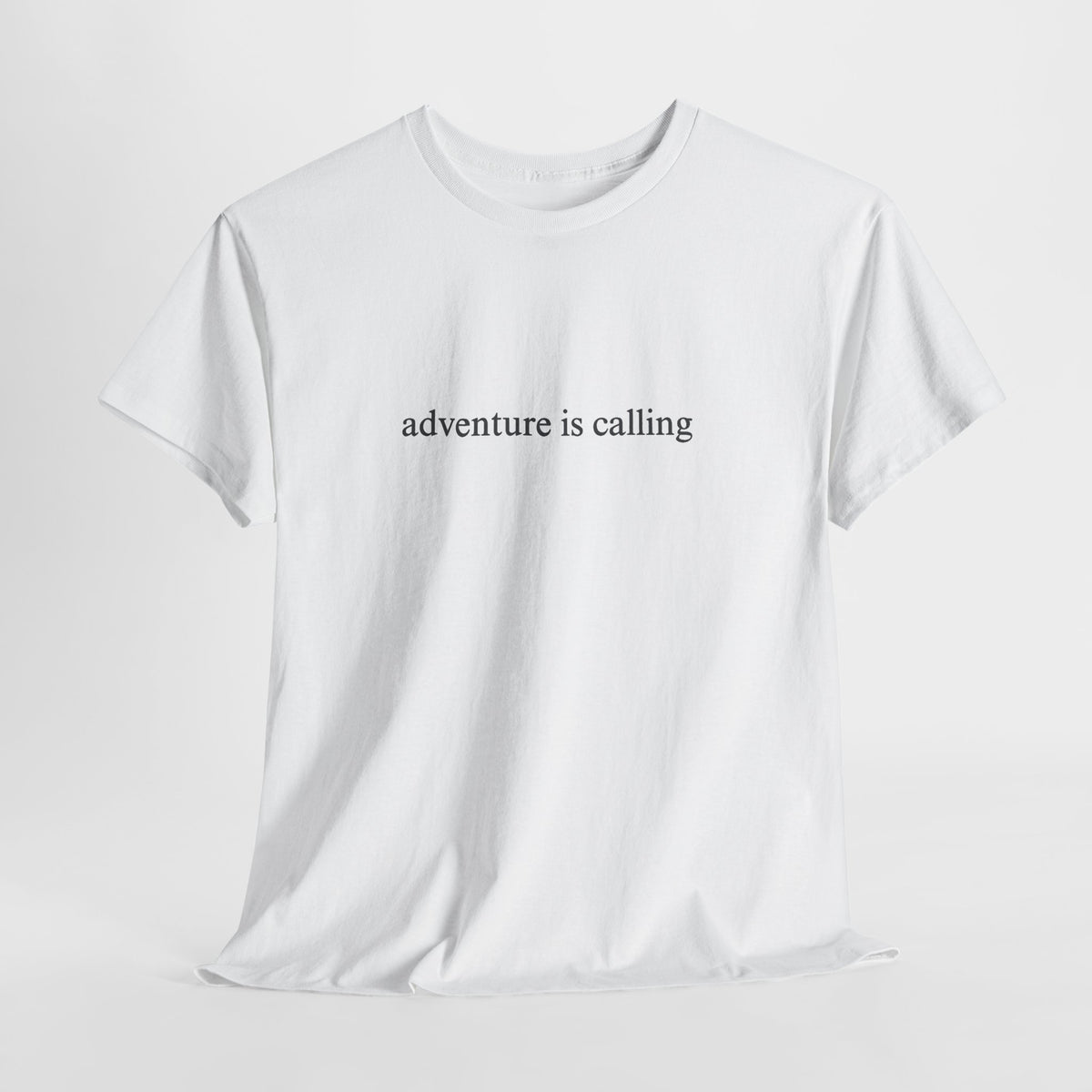 Minimalist t-shirt with a small 'adventure is calling' print on the chest
