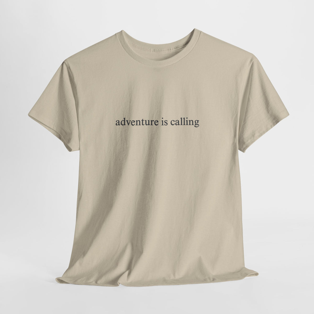 Minimalist t-shirt with a small 'adventure is calling' print on the chest
