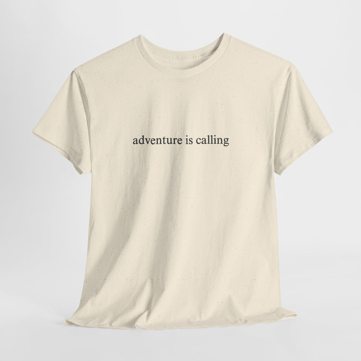 Minimalist t-shirt with a small 'adventure is calling' print on the chest