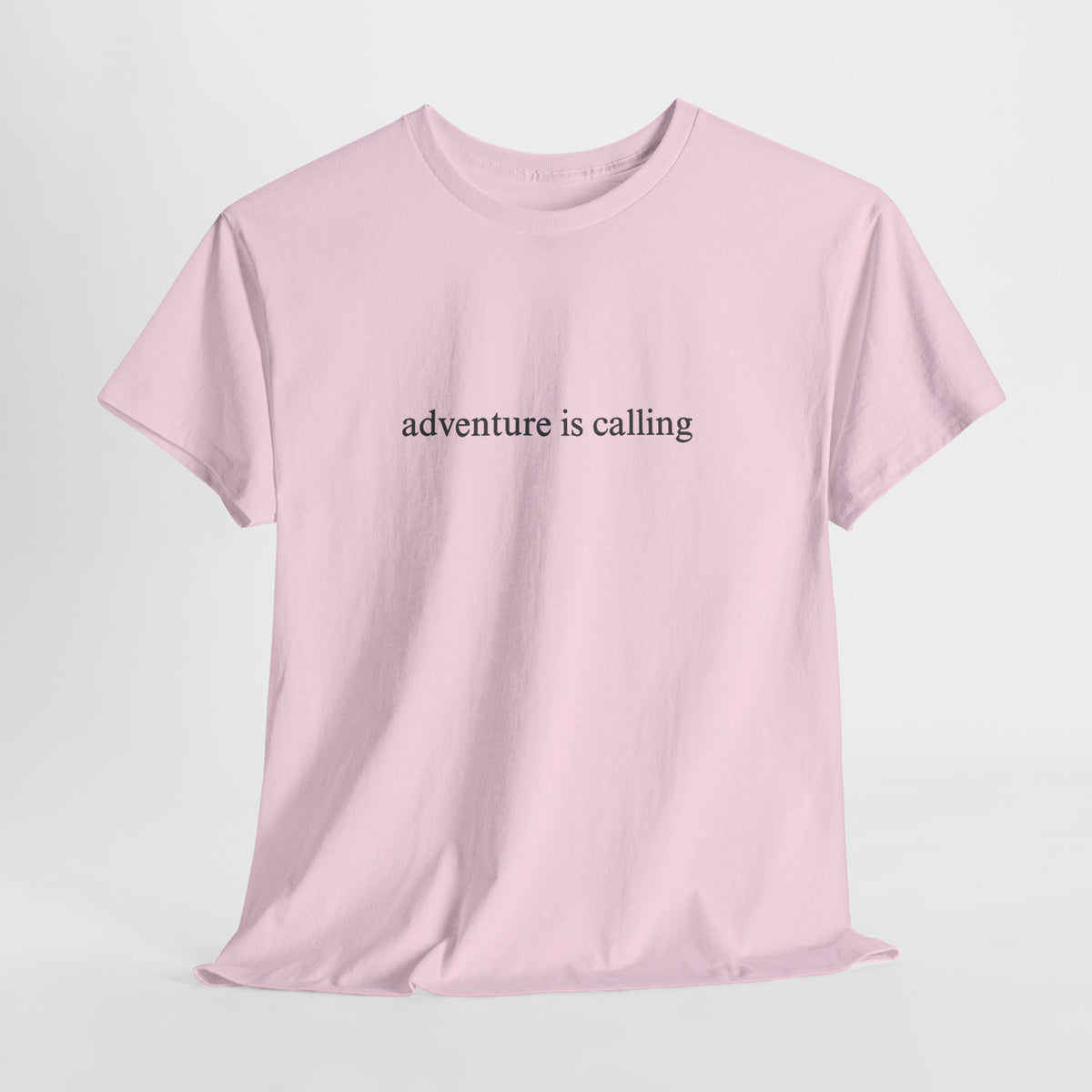 Minimalist t-shirt with a small 'adventure is calling' print on the chest