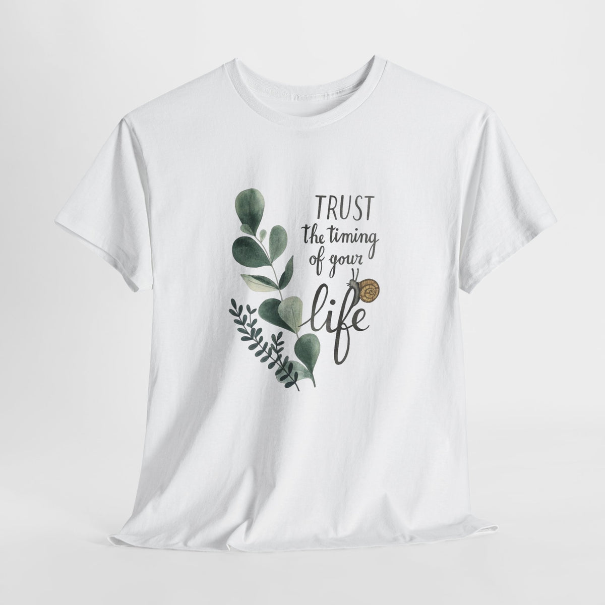 Inspirational t-shirt with a watercolor eucalyptus sprig and 'Trust the timing of your life' script